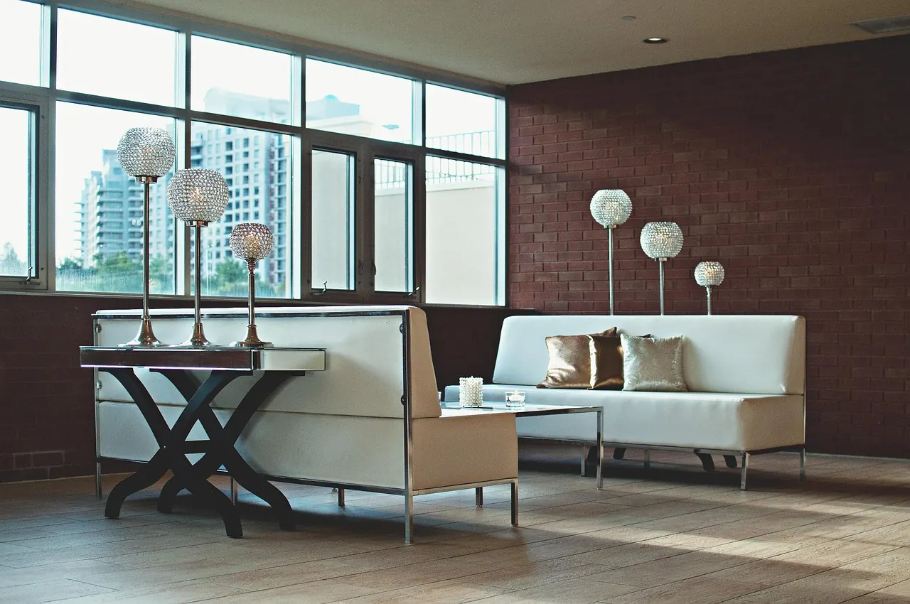 Apartment lounge with large windows and a city view