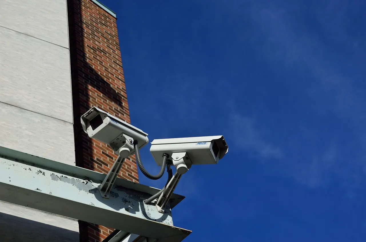CCTV security cameras covering a building corner