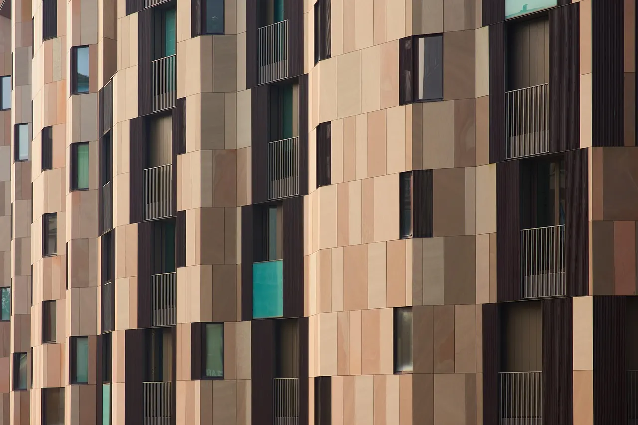 Condominium facade in earth-tone cladding