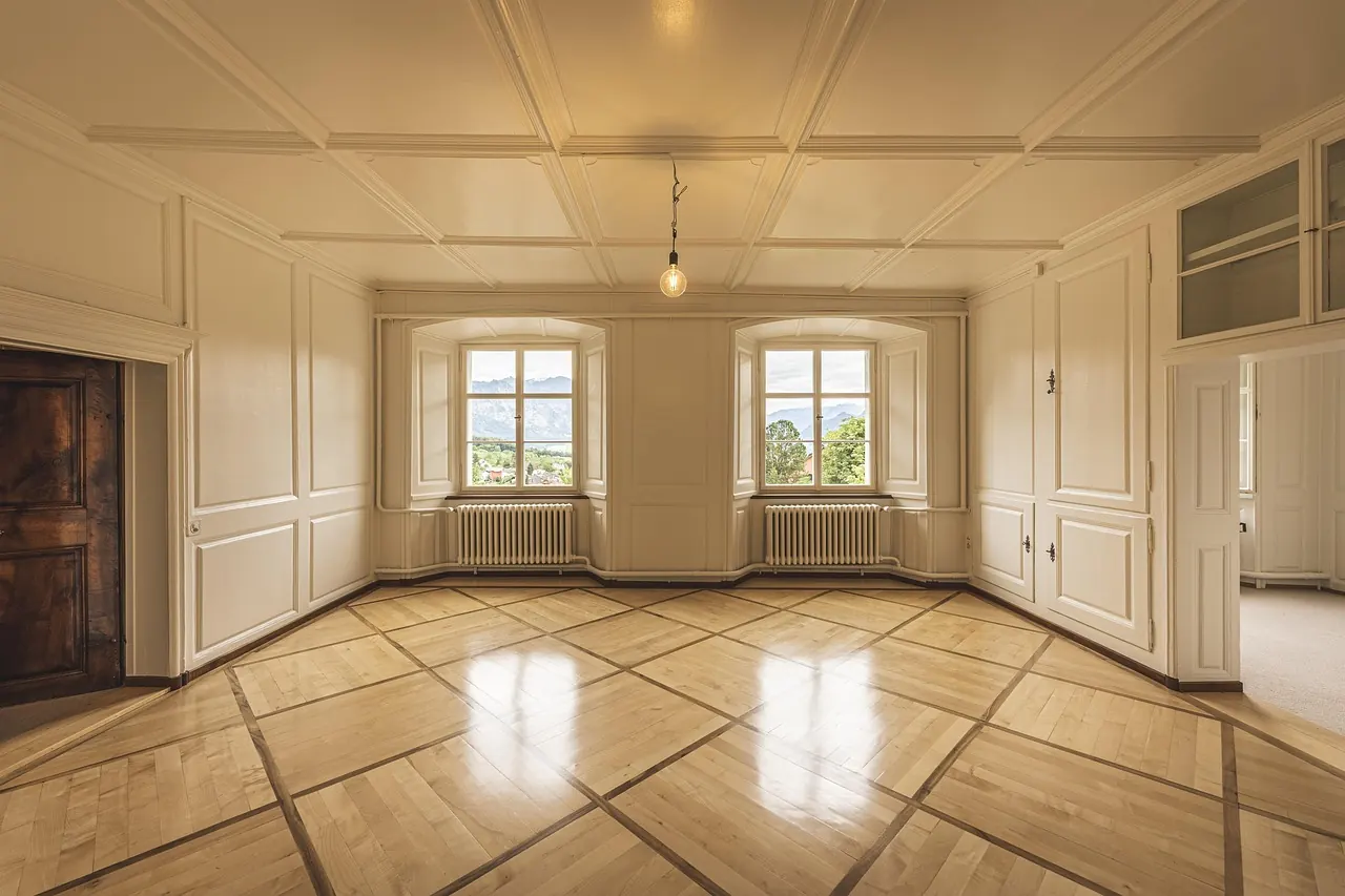 Empty room with polished floor ready for a new owner or tenant