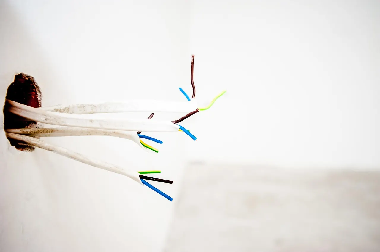 First-fix electrical wiring coming out of a wall before sockets are fitted