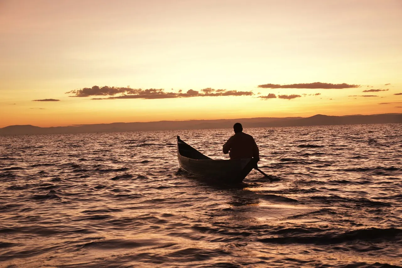 Fishing canoe on Lake Victoria at sunset