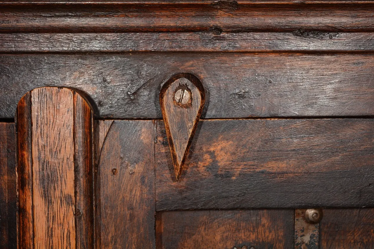 Detail of a solid hardwood door panel and keyhole