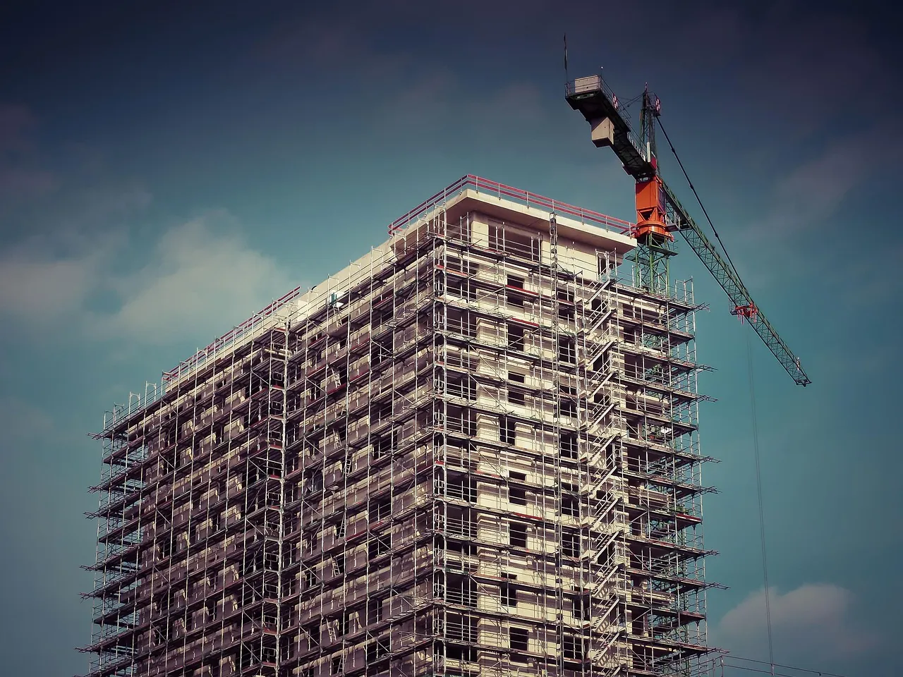 High-rise building construction with a tower crane