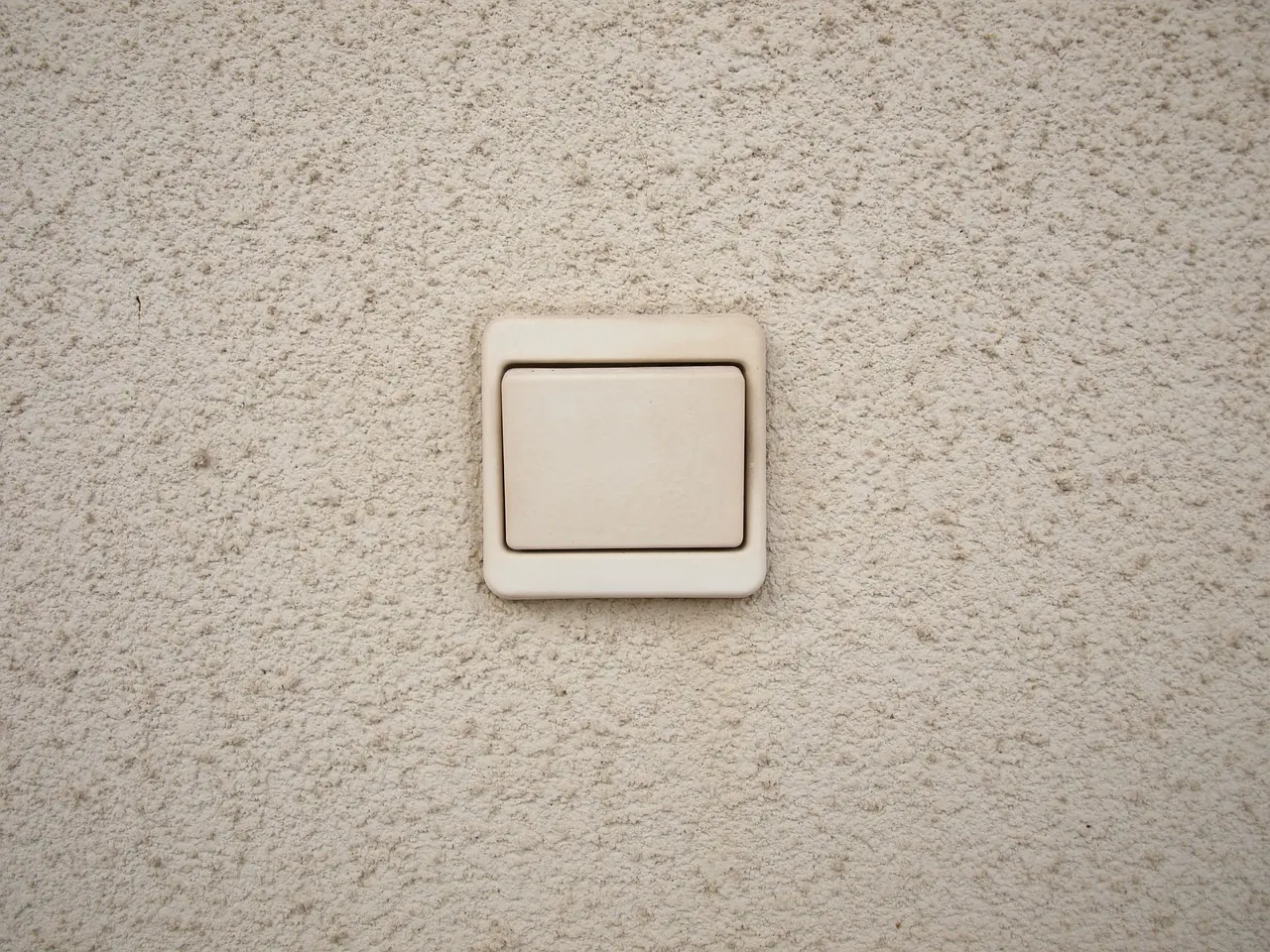 Light switch fitted on a finished plastered wall