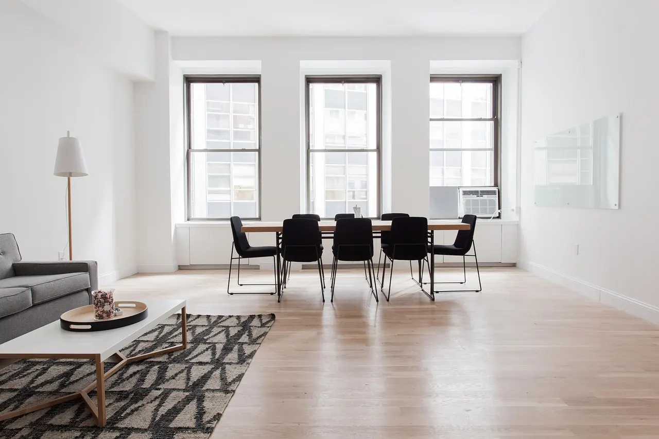 Open-plan dining and living room with hardwood floor