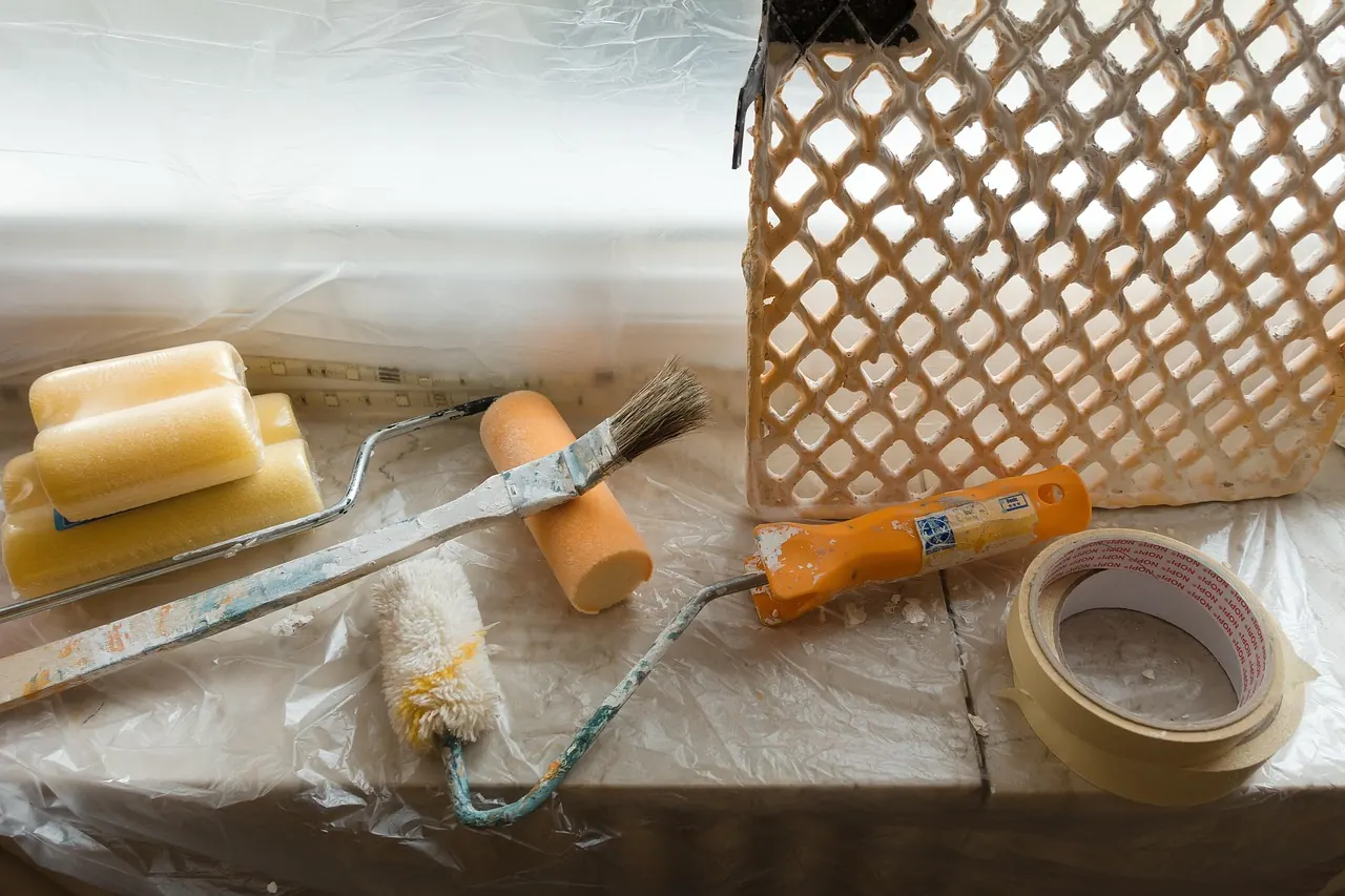 Painting tools, brushes and masking tape ready for interior painting