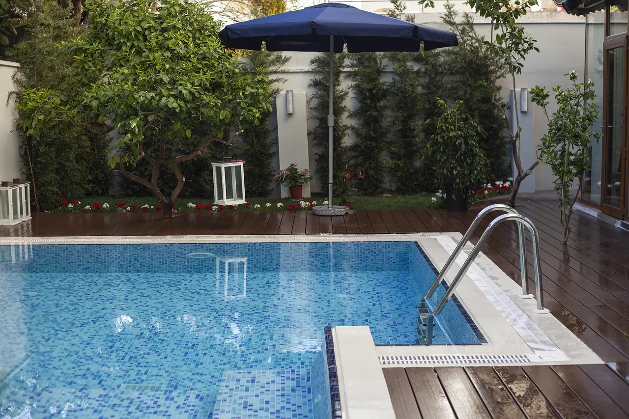 Residential property with a swimming pool and landscaped garden