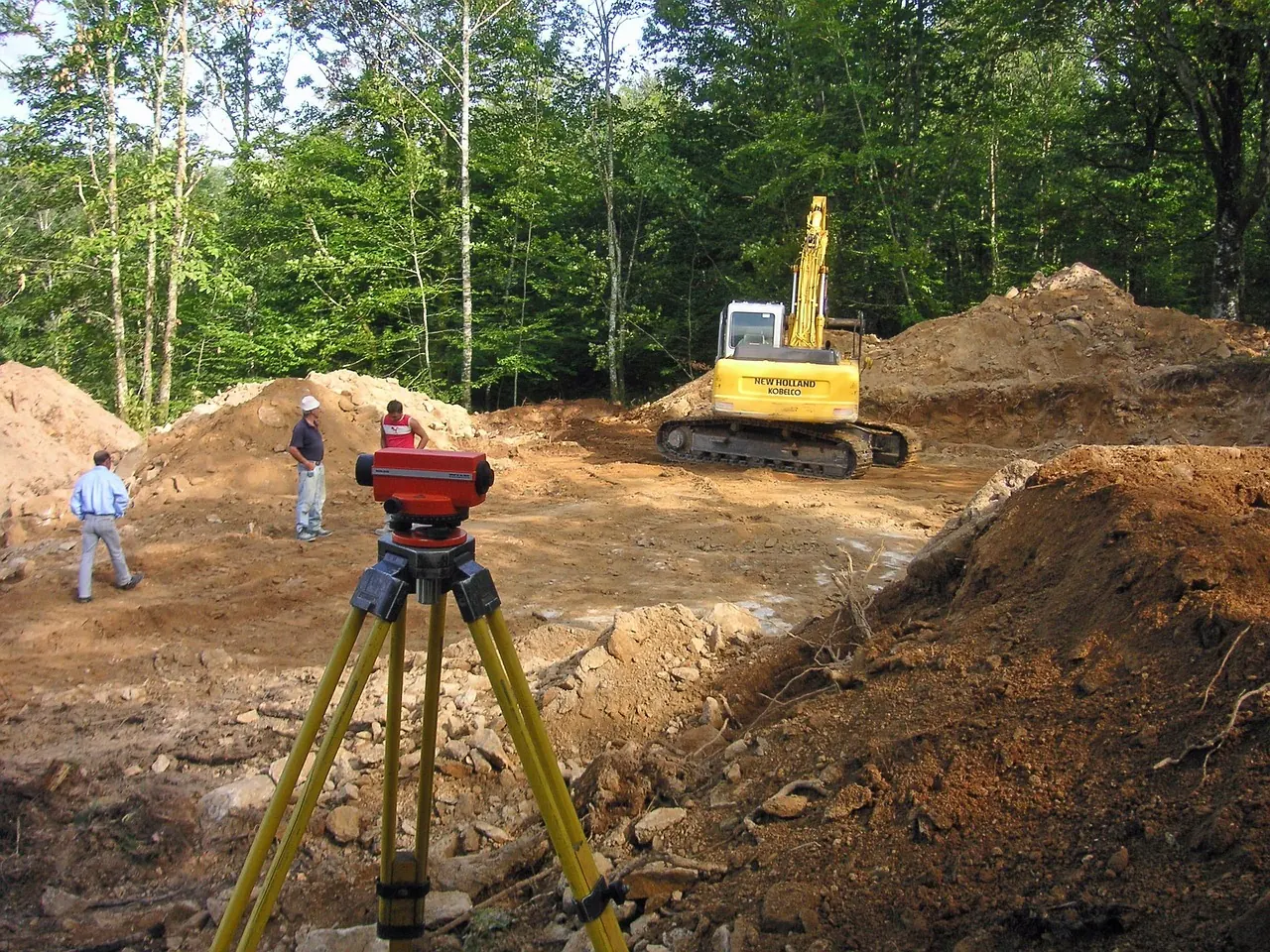 Site surveying with a level during excavation works