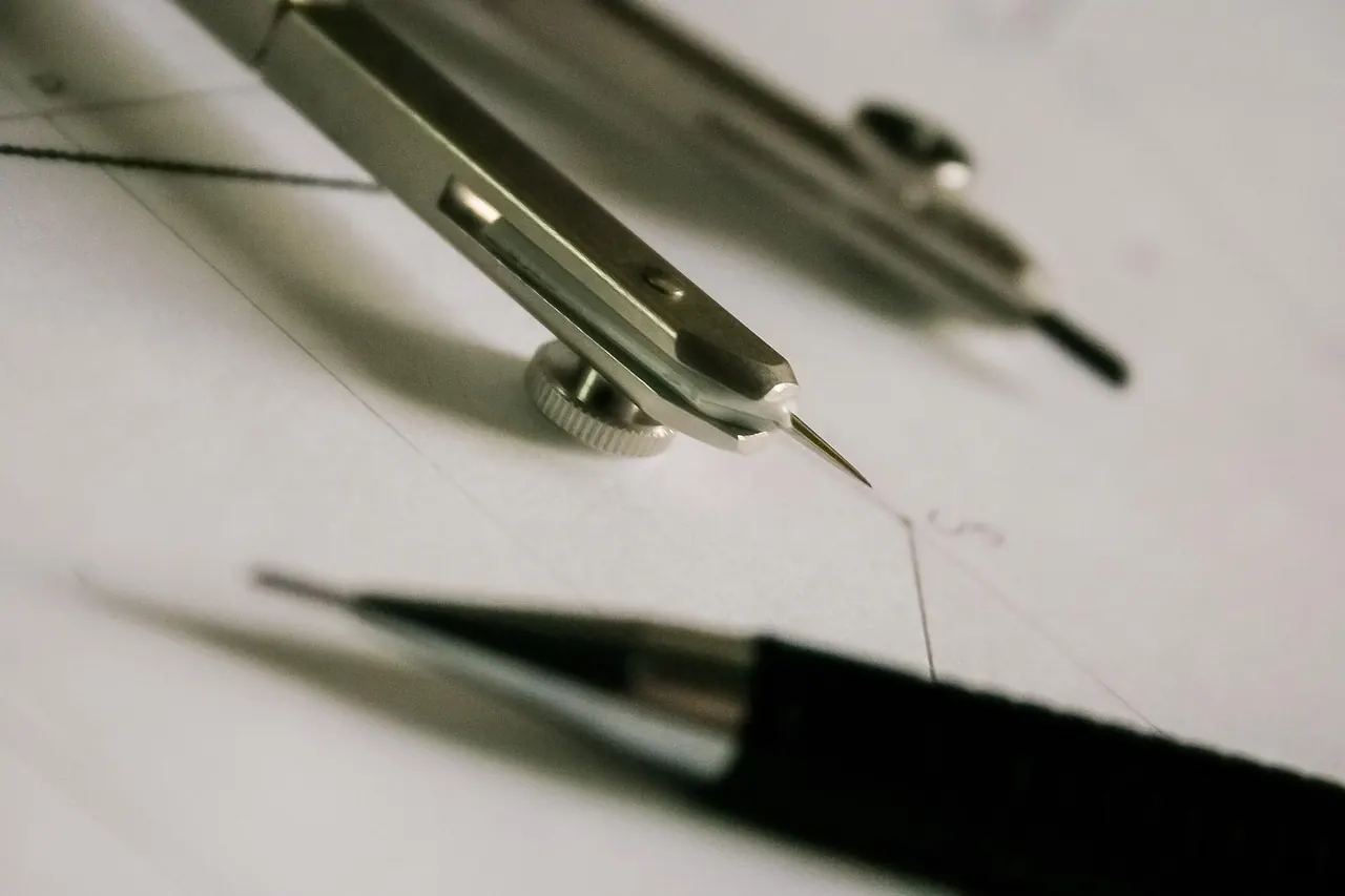 Technical drawing pen and compass used for architectural drafting